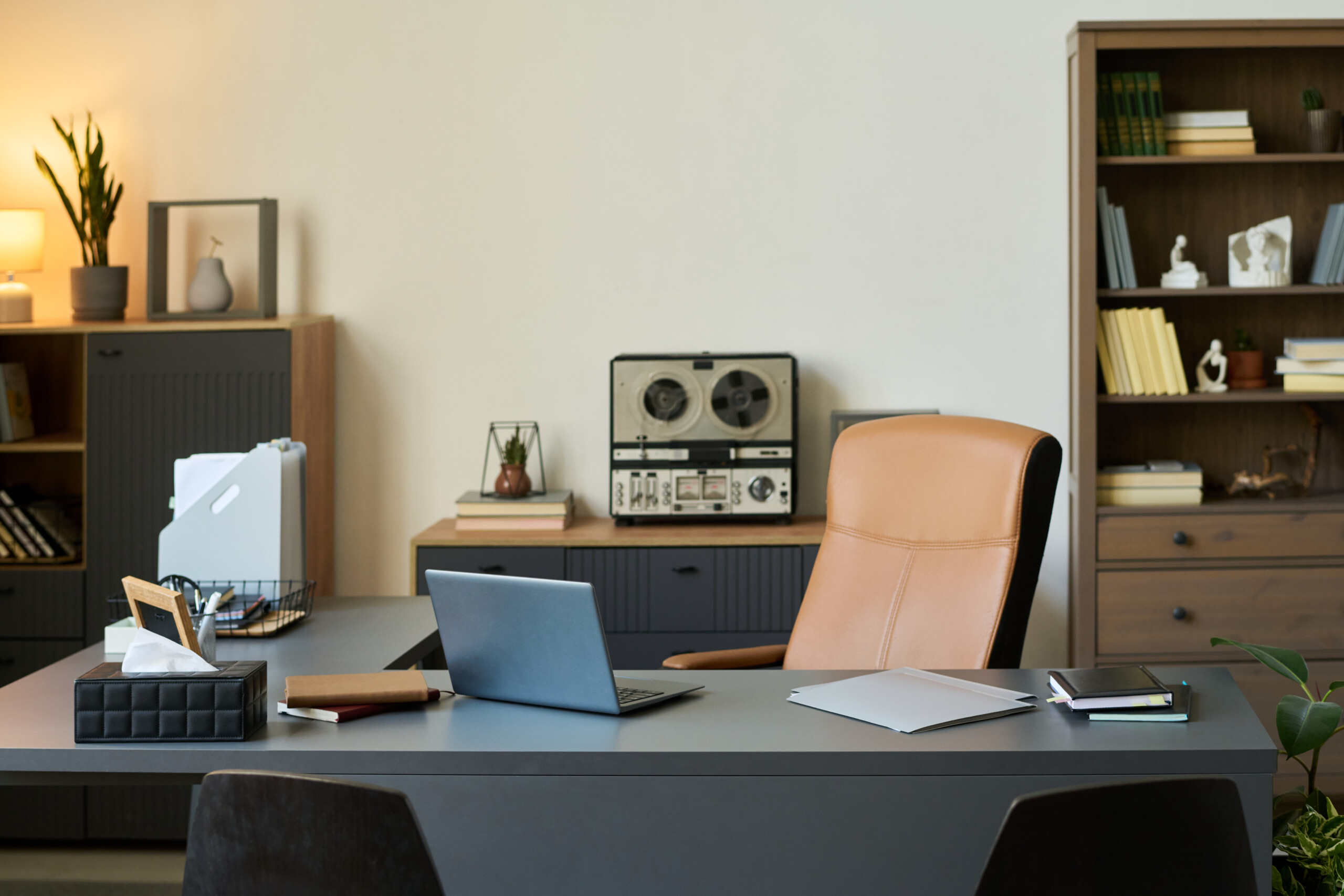 Empty Psychologist Office Interior Featuring Desk Laptop and Therapy Materials